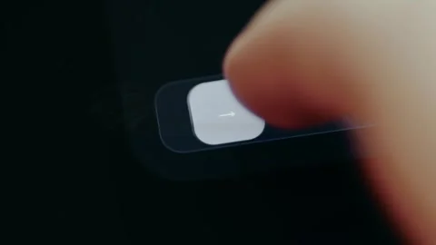 Digital button labeled Slide to Send from a banking app to complete a financial Stock Footage 331581012