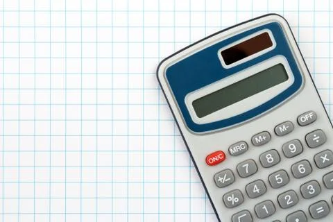 Digital calculator on squared paper background Stock Photos