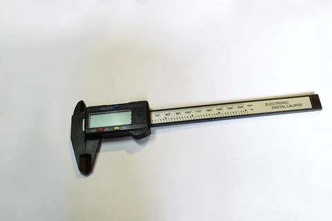 A digital caliper on a white background. Stock Photos