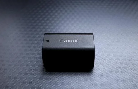 Digital camera battery on black background Foto stock