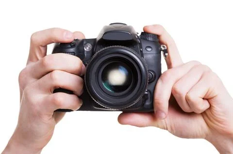 Digital camera. Close-up of man holding digital camera while isolated on whit Stock Photos