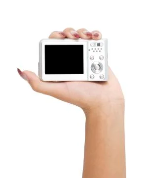 Digital camera in a hand Stock Photos