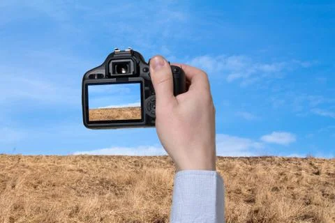 The digital camera in a hand Foto stock