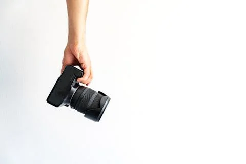 Digital camera in a hand Stock Photos