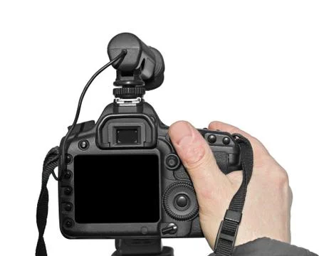Digital camera in hand on a white background Stock Photos