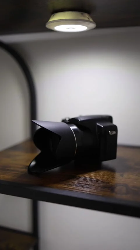 Digital camera on illuminated shelf Stock Footage 336927547