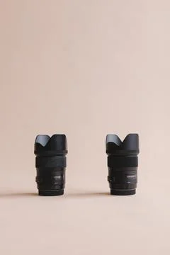 Digital camera lens in pink studio Stock Photos