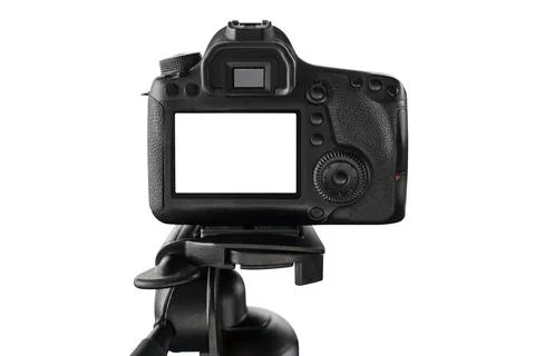 Digital camera with light empty screen standing on tripod Stock Photos
