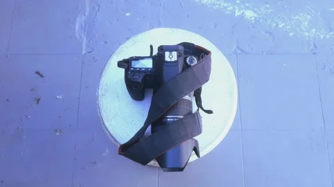 Digital Camera on Round Table Stock-Footage 338110393