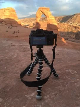 Digital camera set up on a tripod in Arches National Park at the Delicate Arc Stock Photos
