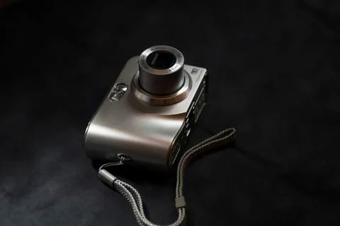 Digital Camera, Silver on Black Background Stock Photos