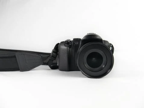 Digital camera standing on a white background. Focus on the lens Stock Photos