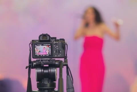 Digital camera that stands on a tripod when shooting a wedding celebration Stock Photos