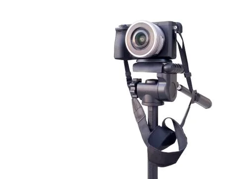 Digital camera on the tripod isolated over white Stock Photos