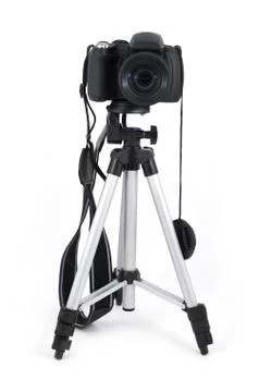 Digital camera on tripod Stock Photos