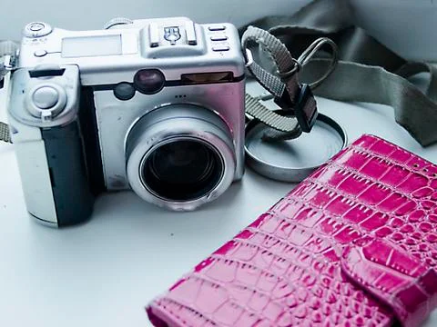 Digital camera on the windowsill Stock Photos