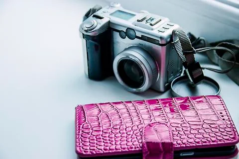 Digital camera on the windowsill Stock Photos