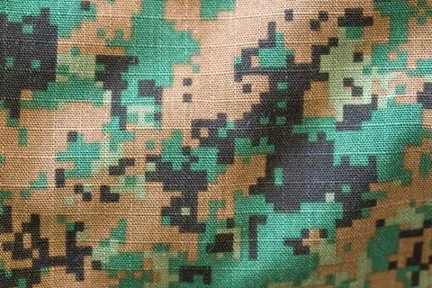 Digital camouflage pattern in teal, brown, and black hues Stockfoto's