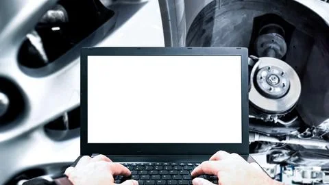 Digital Car Diagnostics, A technician uses a laptop with a blank white screeen Stock Photos