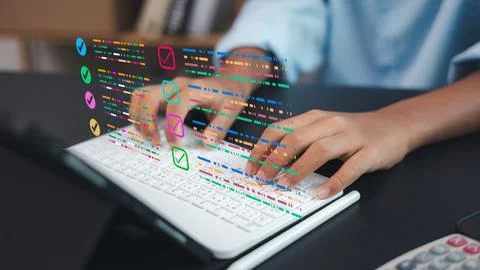Digital Checklist Interface on Laptop Keyboard for Business Productivity Stock Photos