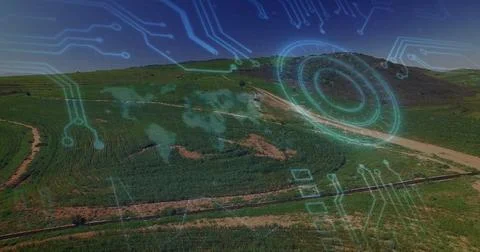 Digital circuit and world map image over aerial view of green landscape Ilustração Stock