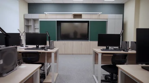Digital classroom features desks with computer monitors Stock Footage 333210450