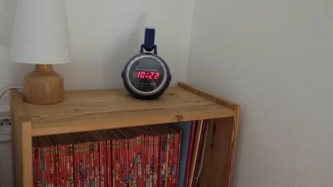 Digital Clock above Shelf of Books 動画素材 99752018