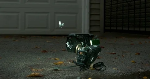 Digital Clock Busts Apart when Dropped Stock Footage 77781681