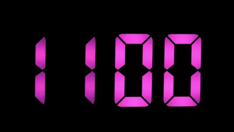 Digital clock display showing 10:59 in pink numbers Stock Footage 335744772