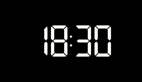 Digital clock display showing evening time with white glowing numbers on a dark Stock Illustration