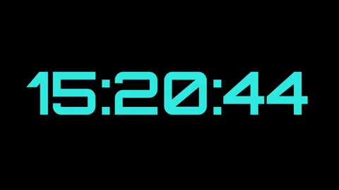 Digital clock displaying time in cyan numbers on black background Stock Footage 337394660