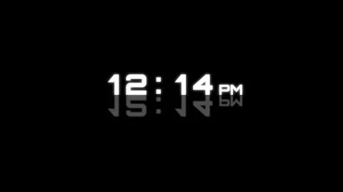 Digital clock face displaying morning and evening time on black background. 4K Stock Footage 340882753