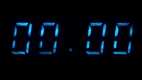 Digital clock with fluorescent display shows 00:00 in blue color Stock Footage 69893717
