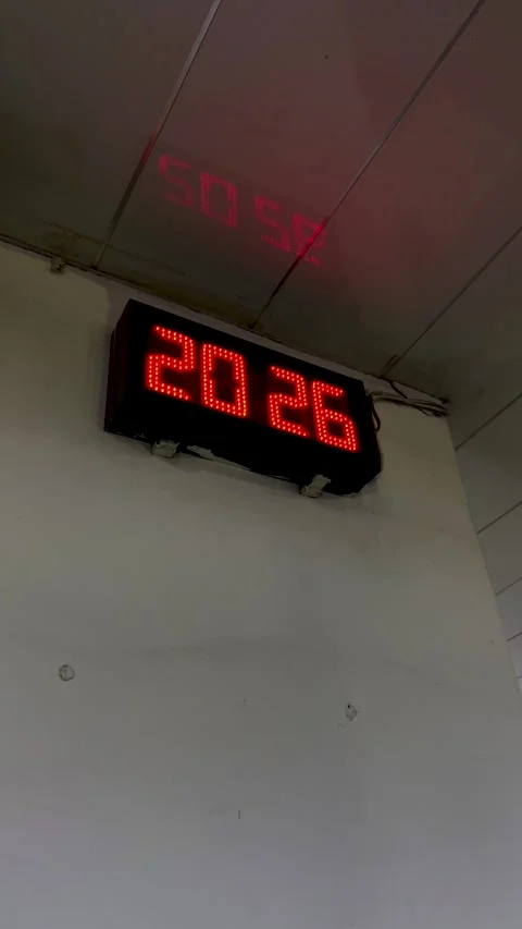 Digital clock with LED red lights changes time from 20:25 to 20:26 Stock Footage 324769612