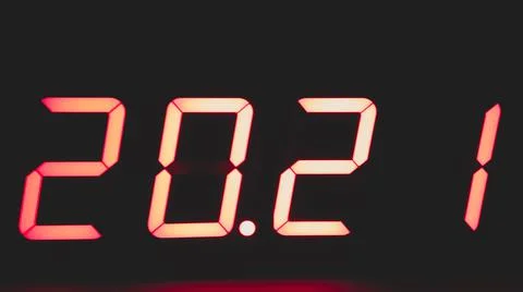 Digital clock with red led light illumination numbers 2021 in the dark Foto stock