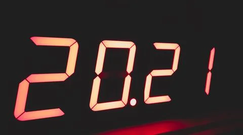 Digital clock with red led light illumination numbers 2021 in the dark Foto stock