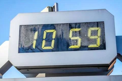 Digital clock is showing 10:59 Stock Photos