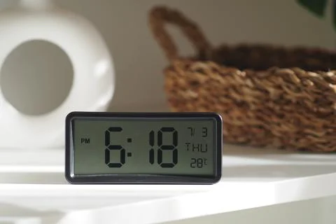 Digital clock showing time and temperature Stock Photos