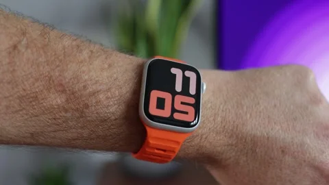 Digital clock time on Apple Watch Series 8 on wrist Stock Footage 265451148
