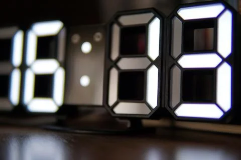 Digital clock with white numbers closeup photo Stock Photos