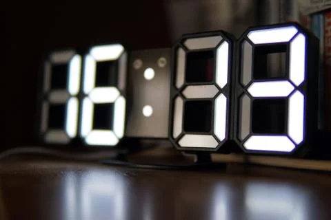 Digital clock with white numbers closeup photo Stock Photos