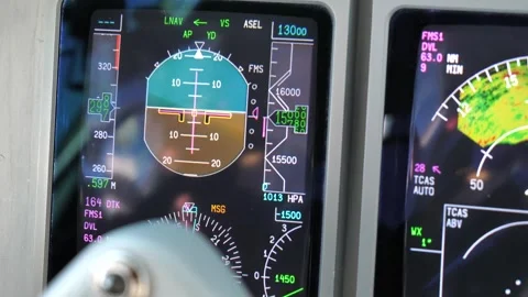 Digital cockpit flight instrument display showing altitude and airspeed in .. Stock Footage 337415136