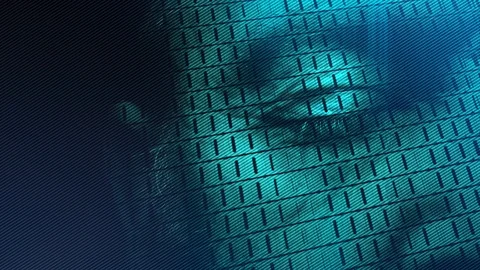 A digital code scrolls across a man's face illuminated in a green blue Stock Footage 102267508