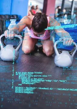 Digital coding screen against a woman working out with kettle bell 写真素材