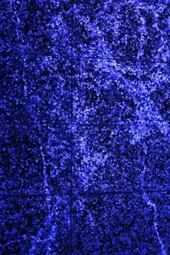 Digital color-inverted version of a concrete tile surface rendered in vibrant Stock Photos