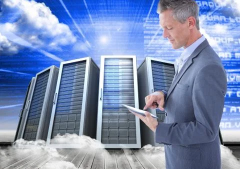 Digital composite image of businessman using digital tablet against server tower Stock Photos