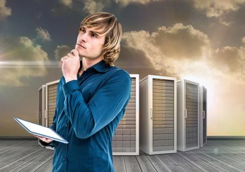 Digital composite image of businessman using digital tablet against server tower Stock Photos
