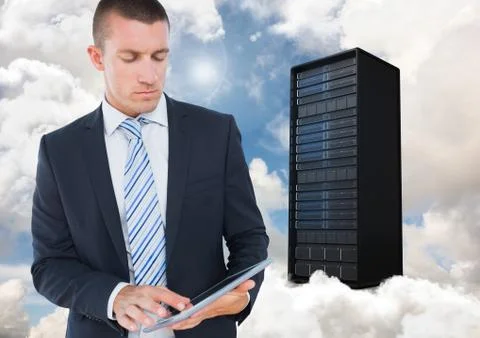 Digital composite image of businessman using digital tablet against server tower Stock Photos