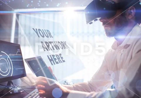 Digital composite image of businessman using virtual reality headset at desk in PSD Template