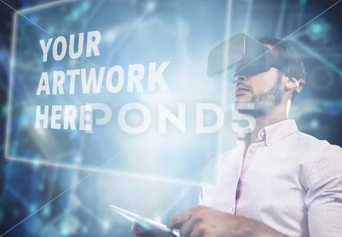 Digital composite image of businessman using virtual reality headset in office PSD Template